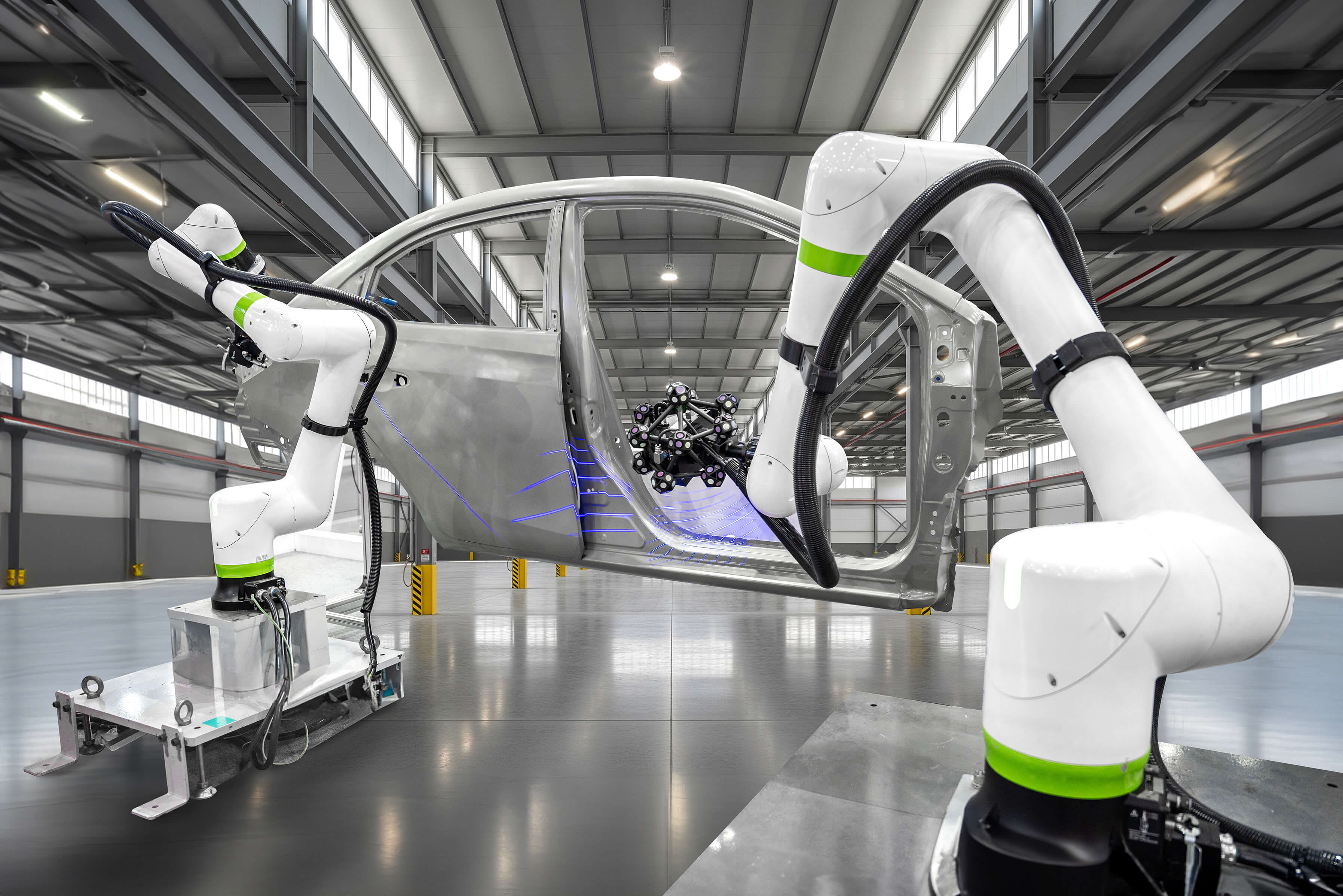 A robot arm performing a laser-enabled part inspection